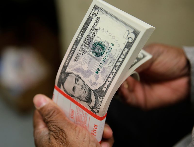 Dollar drifts lower as Fed speakers soothe inflation fears