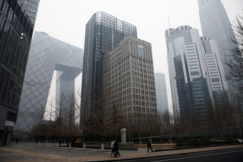 China’s top banking regulator warns of bad debt, local real estate bubbles