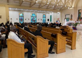 White roses and candles used to memorialize assassinated Haitian president in Little Haiti