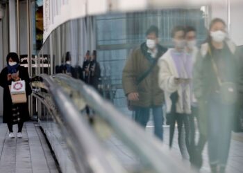 Japan keeps economic view intact, bleaker on outlook due to COVID