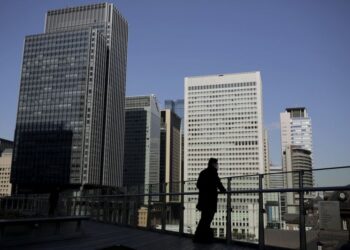 Japan firms see economy recovering to pre-COVID level in FY2022: Reuters poll