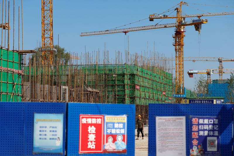 Analysis-Chinese property debt issuers face ‘Evergrande premium’ as worries mount