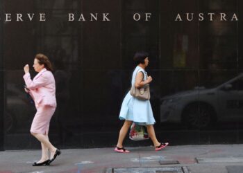 Australia’s central bank opens door to earlier rate rise, pledges patience