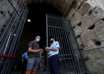 Booking shines on travel rebound, COVID in Europe casts doubts on holiday demand