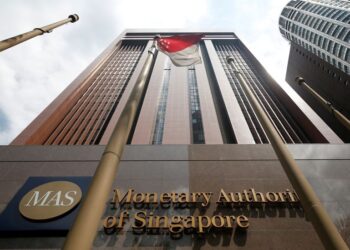 Singapore tightens policy, keeps door open for more moves on hot inflation