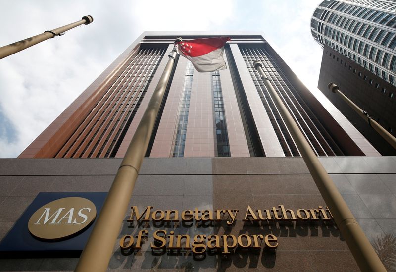 Singapore tightens policy, keeps door open for more moves on hot inflation