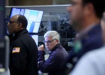 U.S. stocks end a tad higher as Tesla rallies