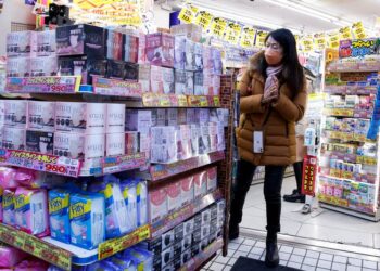 Japan cuts view on economy for first time in 10 months