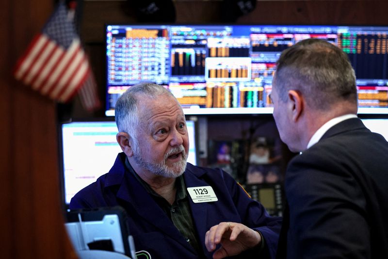 Wall St dips as traders assess hot inflation data; chip stocks weigh