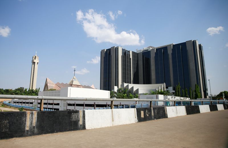 Nigeria’s central bank raises benchmark rate to 24.75% to tame inflation