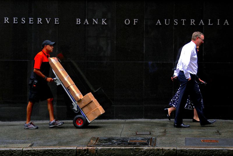 Australia’s central bank says policy is restrictive, causing households pain