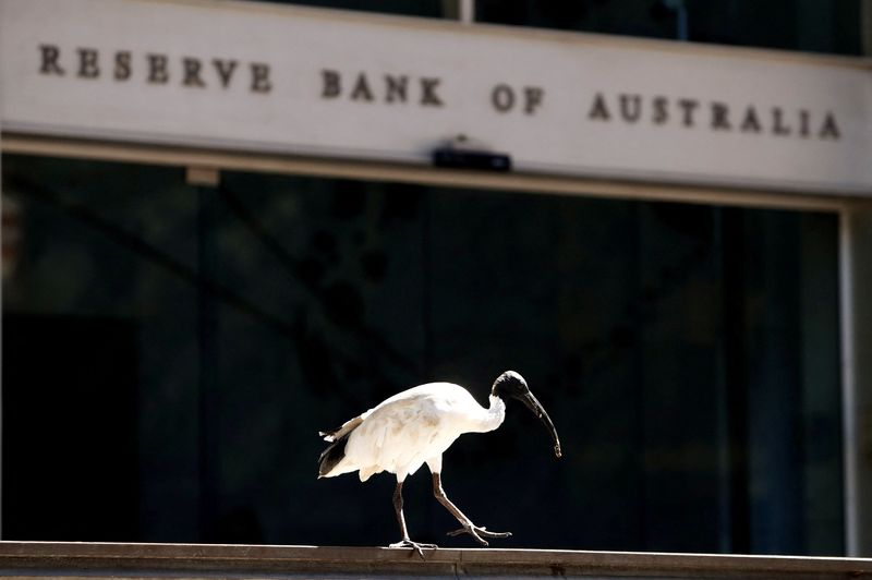 Australia’s central bank holds rates, softens hawkish stance slightly