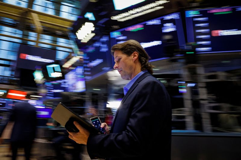 Dow closes at record high as tame inflation report also lifts small caps