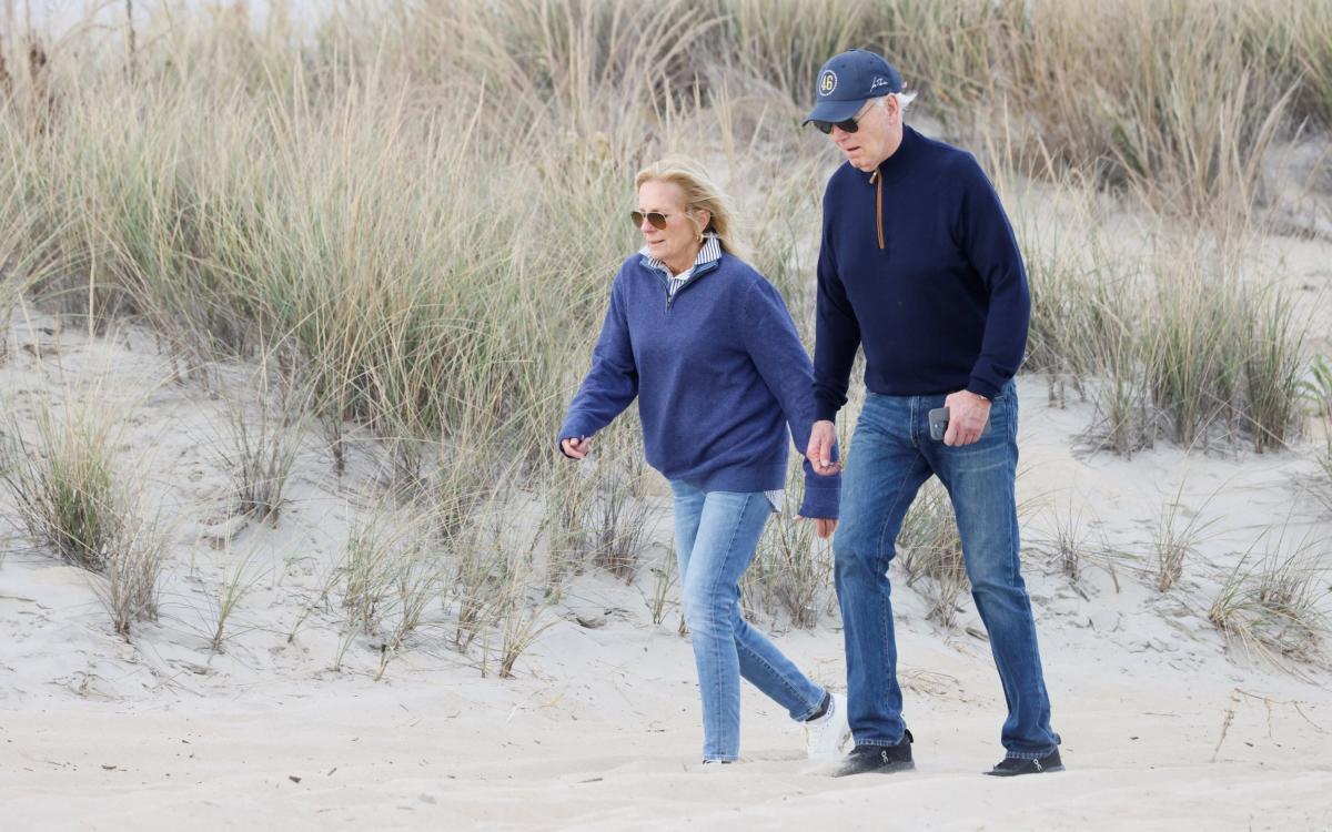 Watch: Stumbling Biden loses footing on beach stroll with first lady