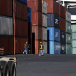 Japan’s exports rise faster than expected, helped by weaker yen