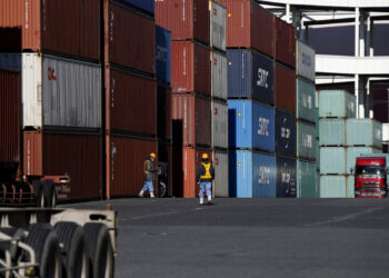 Japan’s exports rise faster than expected, helped by weaker yen