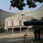 Chinese central banker warns of government bond risks as yields slide