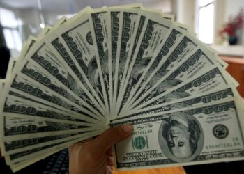 Dollar falls broadly ahead of US data, tariff uncertainty