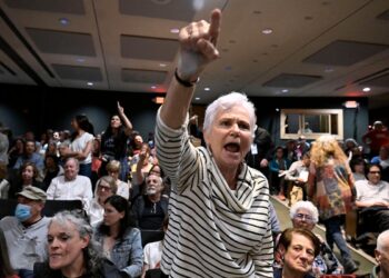 In New York, a GOP congressman is shelled with questions about Trump during raucous town hall