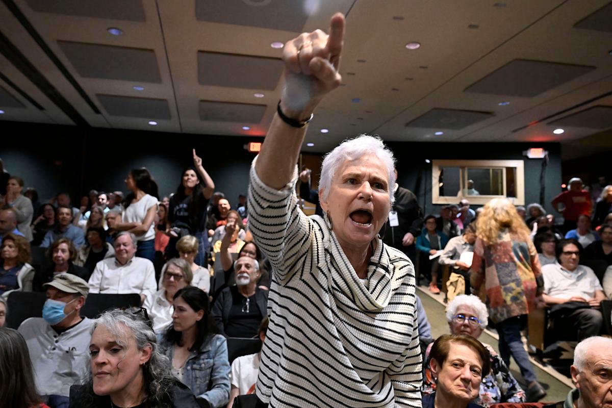 In New York, a GOP congressman is shelled with questions about Trump during raucous town hall