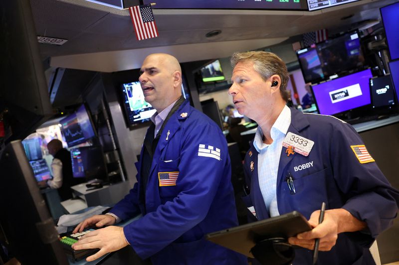 US stocks slip in choppy trade, Tesla slumps on Trump-Musk feud