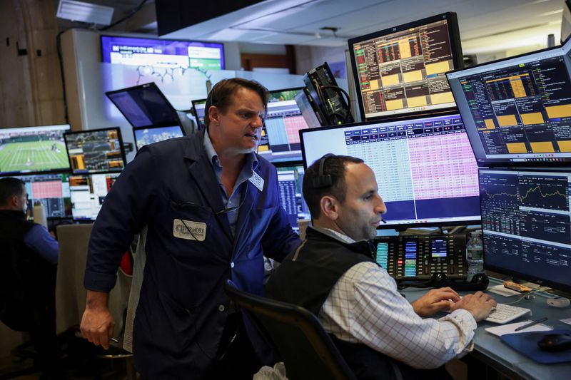 S&P 500, Nasdaq close on record high on Vietnam trade deal, tech stocks