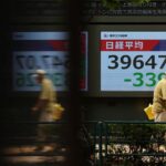 Asian stocks wobble, dollar edges down with tariff deadline in focus