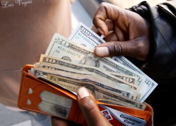 Dollar falls ahead of data releases, risk of US government shutdown looms