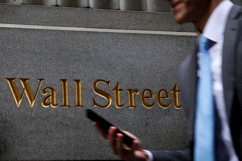 Dow, S&P 500 manage record closing highs; Nasdaq falls in volatile session