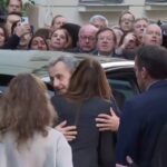 Former French president Nicolas Sarkozy greets supporters, hugs wife before heading to prison