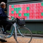 Stocks edge up on Amazon boost, dollar rises after Fed comments