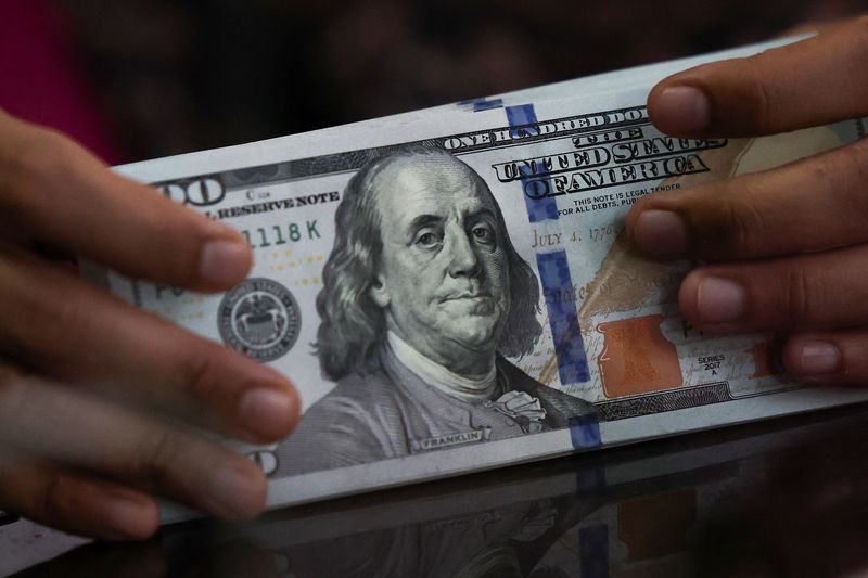 Dollar ends week lower amid Fed outlook, US government shutdown