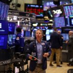 Global shares and dollar higher as markets eye Fed rate cuts