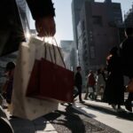 Japan keeps view economy recovering but warns risk from Middle East