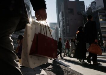 Japan keeps view economy recovering but warns risk from Middle East