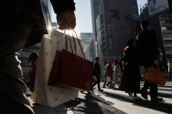 Japan keeps view economy recovering but warns risk from Middle East