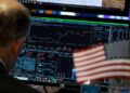 Dow hits record high on US-Iran deal optimism, oil prices slide