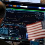 Dow hits record high on US-Iran deal optimism, oil prices slide