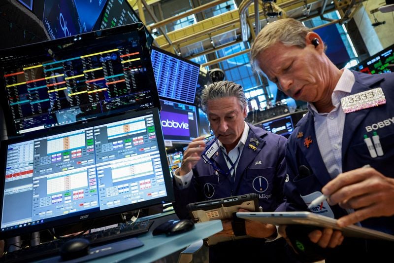 Nasdaq and S&P 500 slip while Dow hits record close