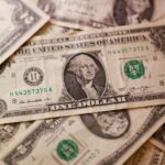 Dollar hits 13-month highs as investors bank on rate hikes