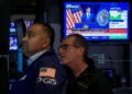 Nasdaq hits record as dollar and Treasury yields climb, oil prices ease