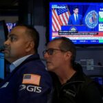 Nasdaq hits record as dollar and Treasury yields climb, oil prices ease