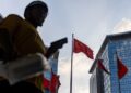 Chinese official says economy resilient but recovery momentum remains weak