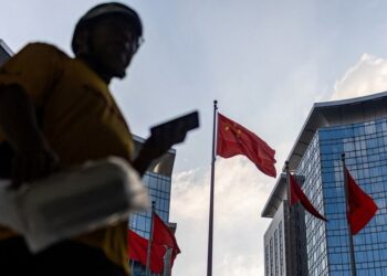 Chinese official says economy resilient but recovery momentum remains weak