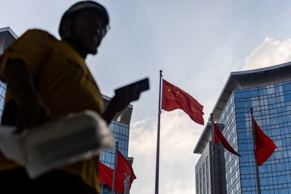 Chinese official says economy resilient but recovery momentum remains weak