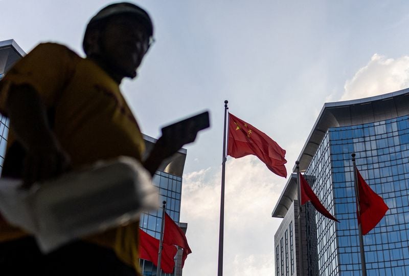 Chinese official says economy resilient but recovery momentum remains weak